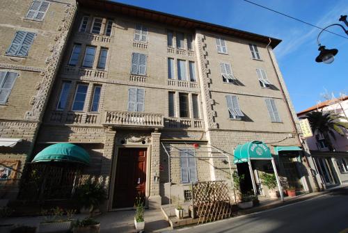 a large brick building on a city street at Tino Brezza di Mare in Deiva Marina