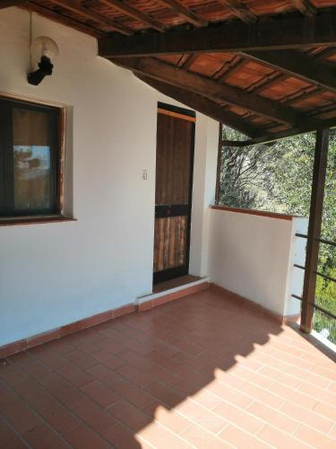 an empty room with a door in a house at Residence Punta Cilento in Pisciotta