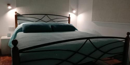 a bedroom with a green bed with two pillows at IBIS Your Cosy Oasis With Private Parking and Patio in Split