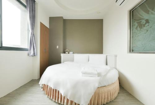 Postel nebo postele na pokoji v ubytování Raise Hotel Taichung