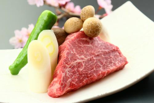 a piece of meat and vegetables on a plate at Amagiso in Kawazu