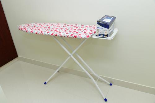 a table with a flower pattern on top of it at Athrakkattu Enclave in Trivandrum