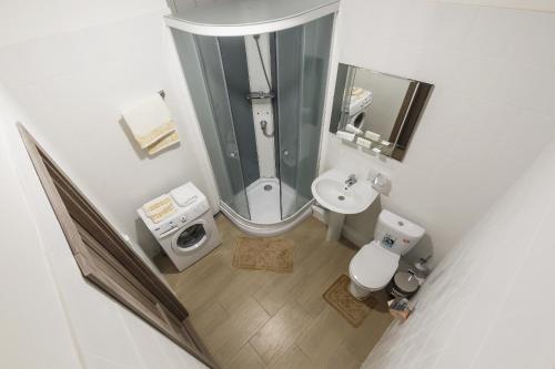 an overhead view of a bathroom with a toilet and sink at SOFT Inn in Yekaterinburg