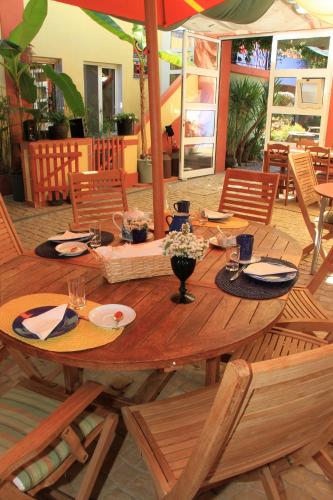 a wooden table with plates of food on it at Casa 3 Águias in Aveiro