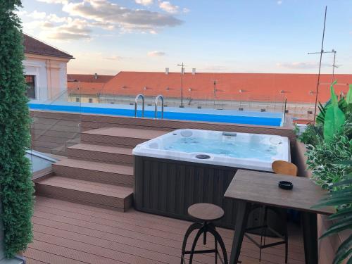 a hot tub on top of a balcony at Boutique hotel Tvrđa in Osijek