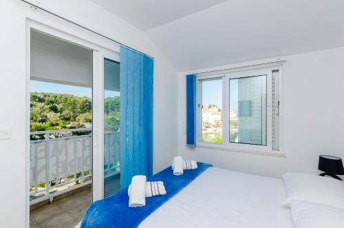 Postel nebo postele na pokoji v ubytování Apartments Lorena Mljet