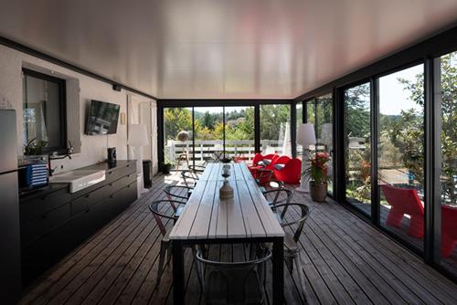 a large living room with a table and chairs at Mise en Scène in Aumelas