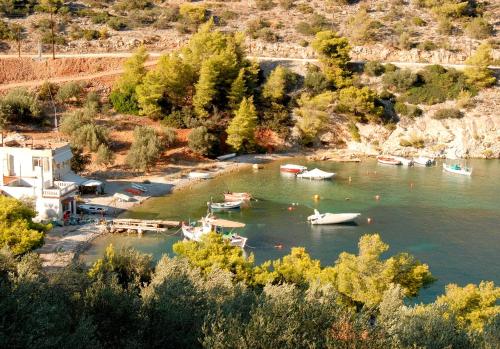 a group of boats in a body of water at Villa Soligia Blue in Pefkali
