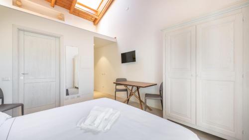 Katil atau katil-katil dalam bilik di Italianway - Locanda della Meridiana