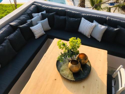 a table with two vases on top of a couch at Kale Lodge - Adult Only + 15 in Kas