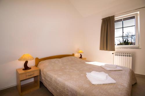 Кровать или кровати в номере Apartman Mendula