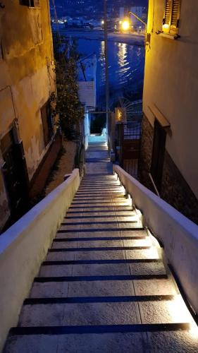 a set of stairs leading up to a building at night at B&B Vistamare Suite in Agropoli