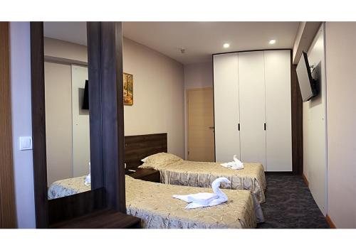 Postel nebo postele na pokoji v ubytování Hotel Ambasador