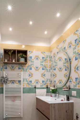 a bathroom with a sink and a mirror at Art de vivre in Sorrento