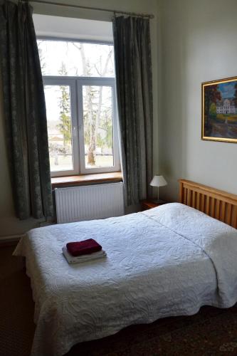 Postel nebo postele na pokoji v ubytování Hotel Grasu Pils