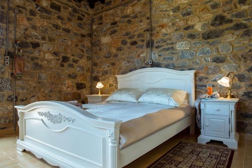 מיטה או מיטות בחדר ב-Villa Mainalis
