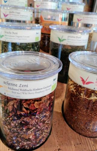 a group of jars of seeds on a table at Familien- & Vitalhotel Auenhof in Fulpmes