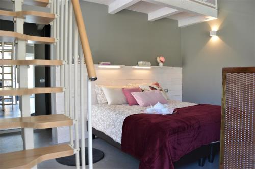 Postel nebo postele na pokoji v ubytování L'ALBEROCASA Eco Residence