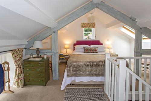 Ένα ή περισσότερα κρεβάτια σε δωμάτιο στο Stable Cottage