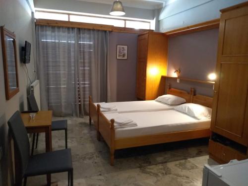 Кровать или кровати в номере Vrachos Κanari