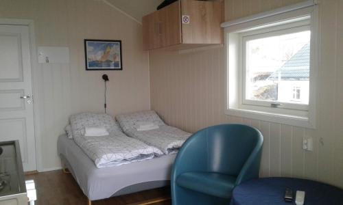 En eller flere senger på et rom på Furoy Fishingcamp and Hotel Apartments