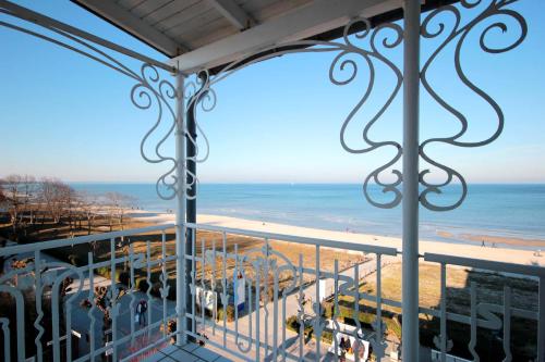 a view of the beach from a balcony at Villa Bellevue Premium by Rujana in Binz