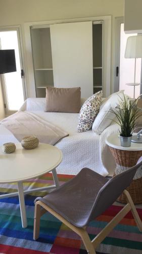 a living room with a couch and a table at Las Eduardas in La Paloma