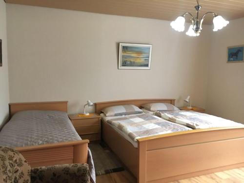 Postel nebo postele na pokoji v ubytování Ferienwohnungen Eichenhof