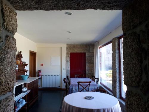 a living room with a table in a room at Casas do Eido e Casa da Viúva in Celorico de Basto