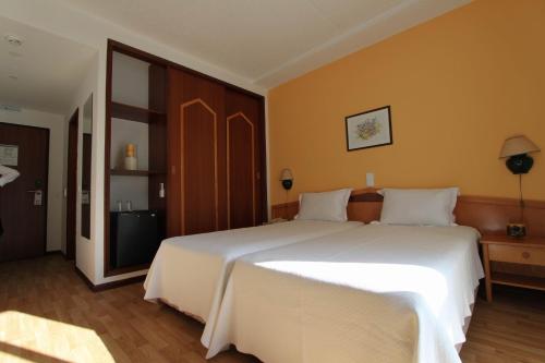 מיטה או מיטות בחדר ב-Hotel Luar