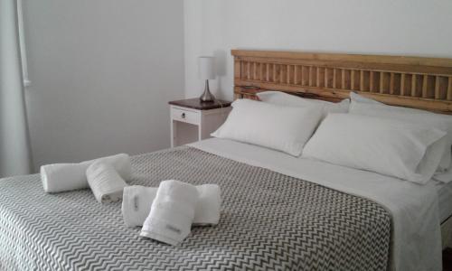 a bedroom with a large bed with towels on it at Palermo Soho in Buenos Aires