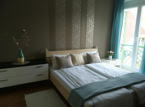 Postel nebo postele na pokoji v ubytování Aqua Apartmanok