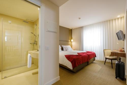 Postel nebo postele na pokoji v ubytování Hotel Regina