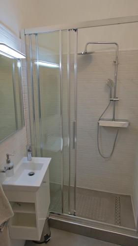 a bathroom with a shower and a sink at Ida in Pula