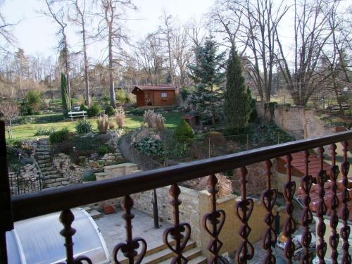 a view of a garden from a balcony at Apartmán pod rozhlednou in Roudnice nad Labem