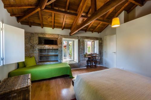 מיטה או מיטות בחדר ב-Quinta da Pousadela - Agroturismo
