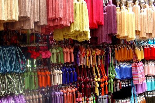a display of different colored umbrellas in a store at Riad Les Nuits de Marrakech in Marrakech