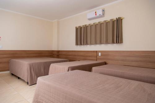 Ένα ή περισσότερα κρεβάτια σε δωμάτιο στο Revitalle Hotel