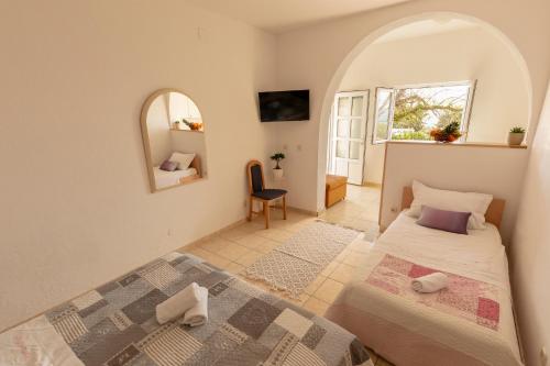 מיטה או מיטות בחדר ב-Apartmani Maja