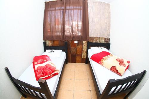 Hotel Contorno Sul tesisinde bir odada yatak veya yataklar