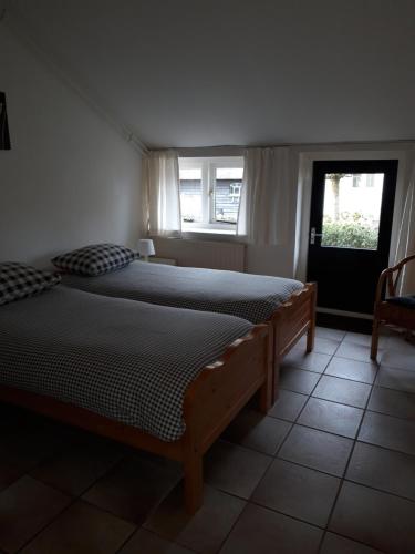 Ένα ή περισσότερα κρεβάτια σε δωμάτιο στο B&B Heida