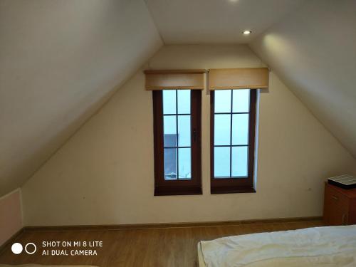 Postel nebo postele na pokoji v ubytování Dom z Sauną - Ługiele