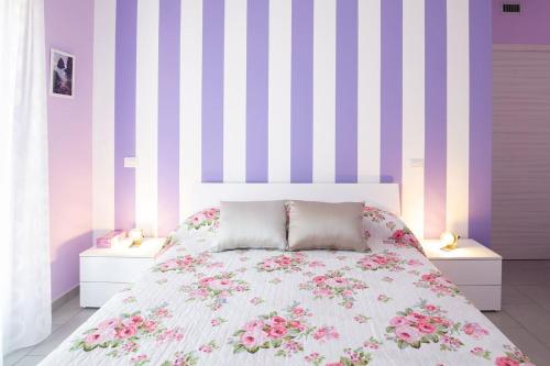 Postel nebo postele na pokoji v ubytování Il Sopracciglio Suites - Pink Apartment