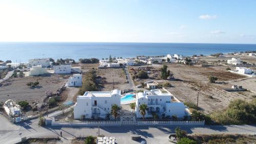 an aerial view of a town with the ocean at Nostos Studios in Perivolos