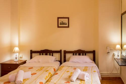 Tempat tidur dalam kamar di Iason Studios