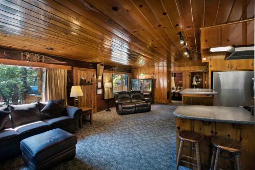 a living room with a couch and a bar in a train at 72 Sequoia in North Wawona