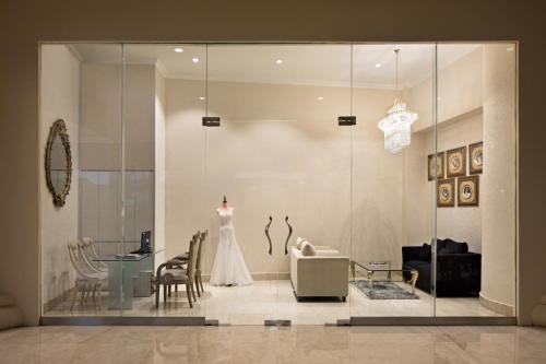 a wedding dress on a mannequin in a room at Golden Boutique Hotel Kemayoran in Jakarta