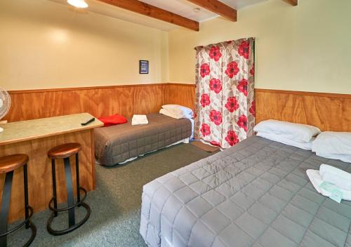 Postel nebo postele na pokoji v ubytování New Central Hotel Woodville