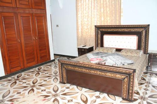 Cama o camas de una habitación en Tulip Guest House Abbottabad