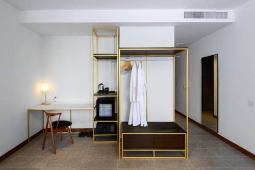 Una cama o camas en una habitación de SAVV HOTEL